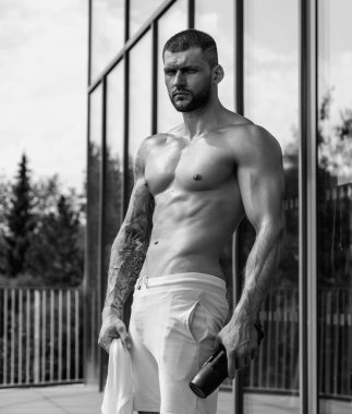 Man exercising with dumbbell. Male bodybuilder doing weight lifting workout at gym. Training with barbell. Muscled man strong muscular fit man workout with heavy weight. Exercises for muscular body