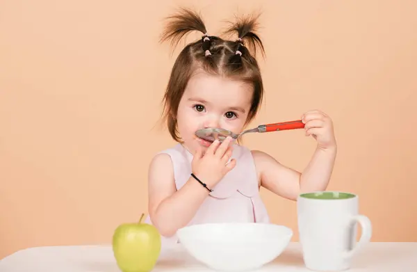 stock image Cute baby child eat food, babies eating. Kid girl eating healthy food