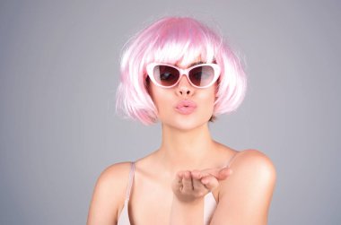 Kiss. Sexy woman sending air kisses. Flirting pout lips isolated on studio color background. Tender girl sending air kiss pout lips. Affection feelings concept. Portrait of sensual woman sends kiss