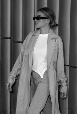 Trendy coat. High fashion model walking on street. Woman fashion style. Fashion beautiful elegant woman. Beautiful woman wearing fashionable clothes. Girl vogue style. Fashion shot