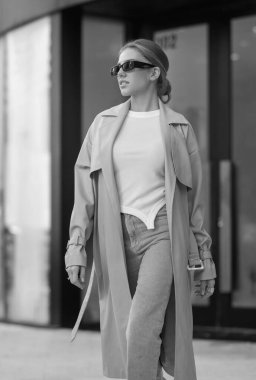 Trendy coat. High fashion model walking on street. Woman fashion style. Fashion beautiful elegant woman. Beautiful woman wearing fashionable clothes. Girl vogue style. Fashion shot