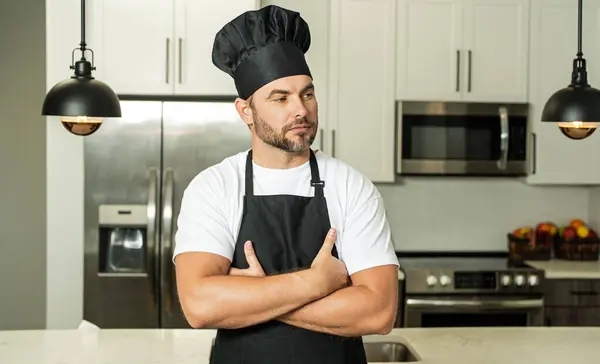 Stock image Portrait of chef, cooks or baker. Man in cook hat and chef uniform cooking on kitchen