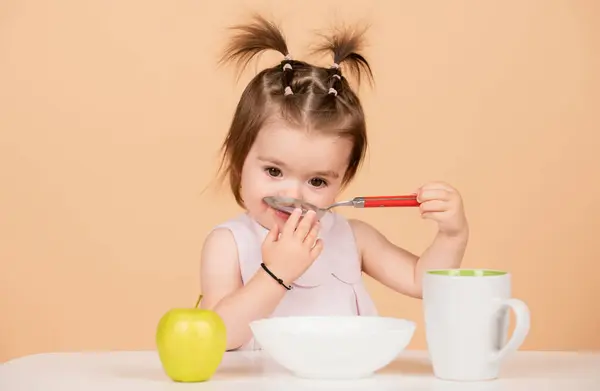 stock image Baby child eating food. Kid girl eating healthy food