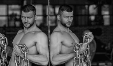 Portrait of handsome sporty man with muscular body doing weight lifting. Guy workout at gym. Fitness trainer, sport instructor, sporty man, fit model, sportsman workout. Power athletic guy bodybuilder