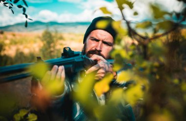 Close up snipers carbine at the outdoor hunting. Man holding shotgun. Hunter with shotgun gun on hunt. Deer hunt clipart