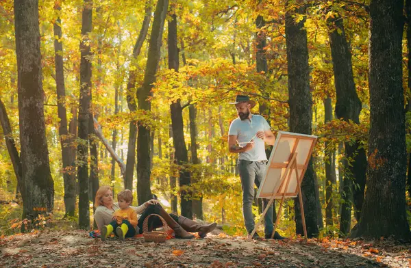 stock image Family camping with kids on autumn park. Dad, mom and son playing together. We like autumn time together. Happy family having fun in autumn park