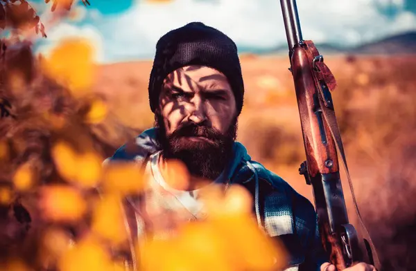 stock image Poacher with Rifle Spotting Some Deers. Illegal Hunting Poacher in the Forest. Hunting season. Poacher concept