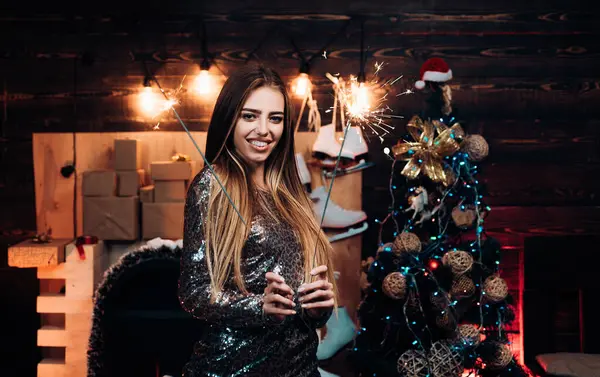 stock image Open Mouth. Expressions face. Friendly and joy. Beautiful Woman with christmas box gif at Home. Comic grimace. Smiling woman decorating Christmas tree at home. Surprise concept