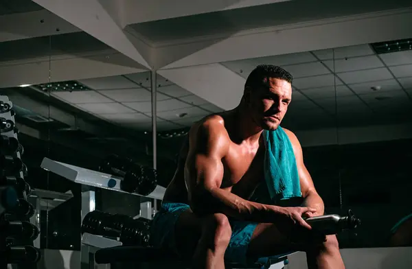 stock image Shirtless sportsman resting after training at the gym. Crossfit, sport and healthy lifestyle concept