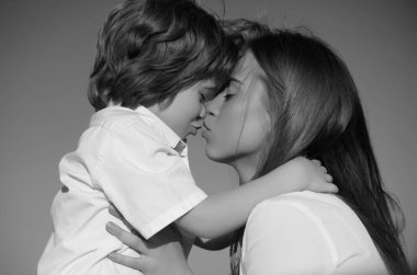 Mother kiss. Closeup portrait of mother and child kissing. Mother hugging and embracing son. Mothers day, love family. Mother and child with tenderness. Mothers kiss child, cuddle warm relationships