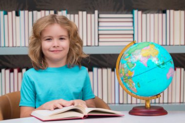 Child from elementary school with book. Little student, clever nerd pupil ready to study. First time to school. Concept of education and learning