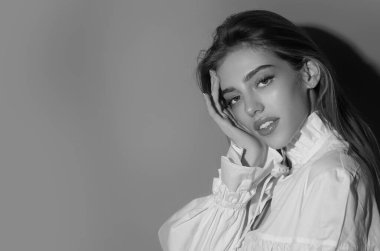 Beauty portrait of young blonde woman. Sexy model posing in studio. Portrait of beautiful girl. Beauty woman face closeup. Pretty girl portrait. Sensual look. Beautiful female portrait