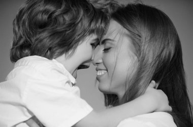 Mother kiss. Closeup portrait of mother and child kissing. Mother hugging and embracing son. Mothers day, love family. Mother and child with tenderness. Mothers kiss child, cuddle warm relationships