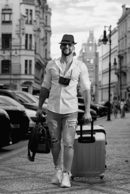 Traveller, fashion tourist. Traveler student or young tourist. Tourist businessman traveling in european city. Confident rich man traveling in european city