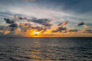 Sunset on sea background. Nature wallpaper with summer sea. Water sea texture. Calm sunrise on tropical sea. Scenery sunset, ocean landscape