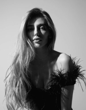 Sexy attractive woman with slim sexy body posing in fashion dress in studio. Beautiful sexy model portrait. Beauty woman face. Attractive sensual girl