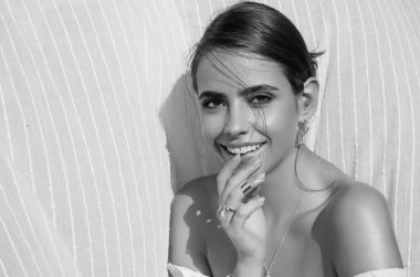 Romantic young woman posing near summer greenery outdoor. Country style. Sensual girl at countryside. Summer freedom lifestyle. Country hippie girl