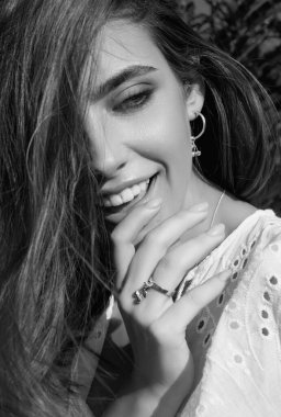 Romantic young woman posing near summer greenery outdoor. Country style. Sensual girl at countryside. Summer freedom lifestyle. Country hippie girl