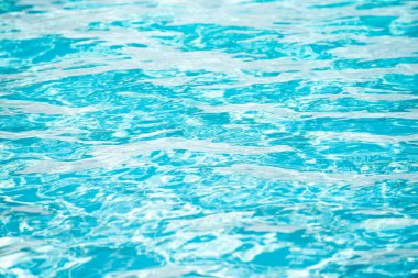 Yüzme havuzunda su, yüksek çözünürlüklü arka plan. Dalga soyut veya dalgalı su dokusu