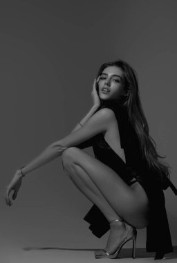 Beautiful sensual young woman in fasion dress. Beautiful model, sexy girl face. Fashion and beauty. Sensual girl with naked sexy body. Natural female beauty and sexy concept