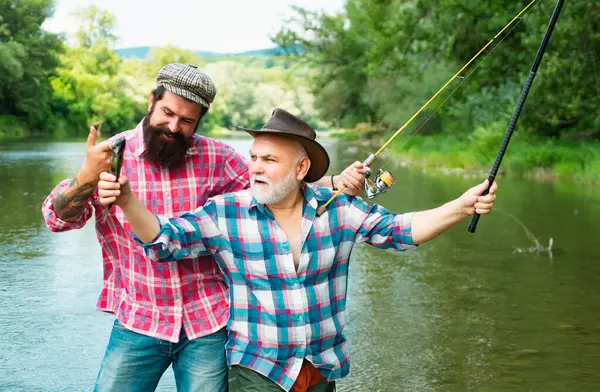 stock image Fisherman fishing with spinning reel. Fly fishing in the pristine wilderness of canada. Fishing became a popular recreational activity