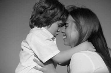 Mothers love. Closeup portrait of mother and child kissing. Mother hugging and embracing son. Mothers day, love family. Mother and child with tenderness. Mothers kiss child, cuddle warm relationships