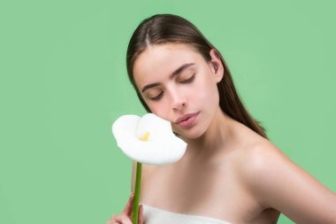 Beauty girl with calla lily. Beautiful sensual woman hold flowers, studio portrait