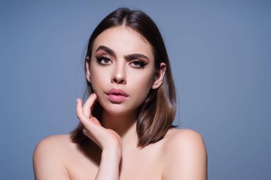 Sensual woman face, beautiful girl. Young woman look sensual. Charming beauty sexy lady with beauty sensual face. Fashion model. Studio portrait of sensual girl in studio