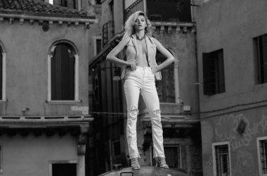 Seductive sexy lovely attractive young sensual woman tourist with perfect slim body posing on outdoor street. Beautiful elegant sexy model, studio portrait. Sensual beautiful woman face