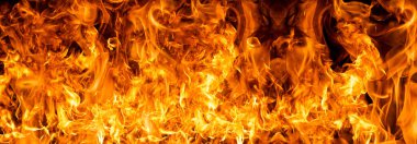 Yangın bayrağı. Yanan Alevler. Canlı renklerle parlayan ateş. Alevli arka plan. Ateşli bir doku. Yüksek çözünürlükte yanan paternler. Kızgın alevler. Yangın arka planı. Büyük alevler
