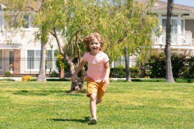 Healthy sport activity and running for children. Little boy at race. Young athlete in training. Runner exercising. Jogging for kid