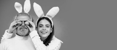 Easter couple on blue background isolated. Panoramic web banner frame