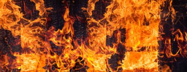 Yangın bayrağı. Yanan Alevler. Canlı renklerle parlayan ateş. Alevli arka plan. Ateşli bir doku. Yüksek çözünürlükte yanan paternler. Kızgın alevler. Yangın arka planı. Büyük alevler