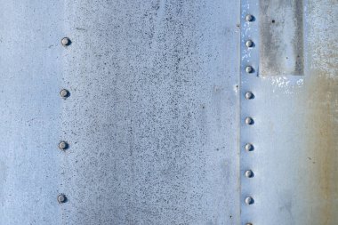 Paslı arka plan dokusu. Metal yüzey. Endüstriyel paslı çelik. Paslı metal. Yaşlanmış metalik arka plan. Lekeli ve oksitlenmiş metal levha. Pas dokusu. Metal korozyon. Yapılandırılmış ve hasarlı demir