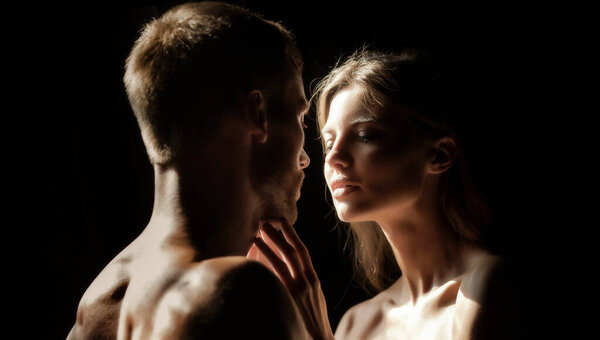 Couple in love face to face, tender hugging and kissing. Beautiful woman and handsome man boyfriend