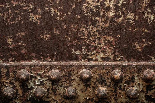 Paslı arka plan dokusu. Metal yüzey. Endüstriyel paslı çelik. Paslı metal. Yaşlanmış metalik arka plan. Lekeli ve oksitlenmiş metal levha. Pas dokusu. Metal korozyon. Yapılandırılmış ve hasarlı demir