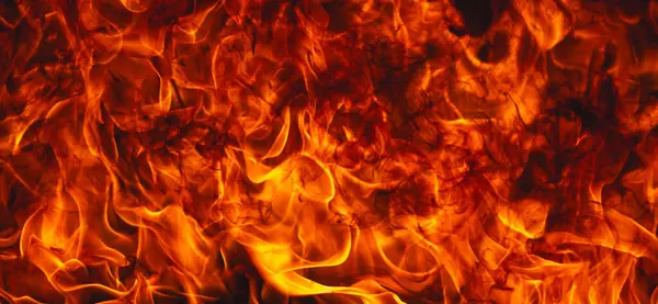 Siyah arka planda ateş dokusu. Soyut yangın arka planı, büyük yanan ateş