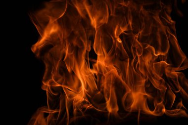 Siyah arka planda ateş dokusu. Soyut yangın arka planı, büyük yanan ateş