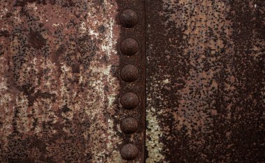 Paslı arka plan dokusu. Metal yüzey. Endüstriyel paslı çelik. Paslı metal. Yaşlanmış metalik arka plan. Lekeli ve oksitlenmiş metal levha. Pas dokusu. Metal korozyon. Yapılandırılmış ve hasarlı demir