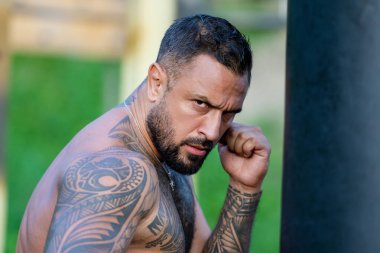 Man boxer. Sweat flies, fists collide. Mans fight. Breath heavy, punches light. Dirt kicks up. In the outdoor boxing arena. Guy ready for boxings challenge. Man fight. Boxings fight. Boxing sport