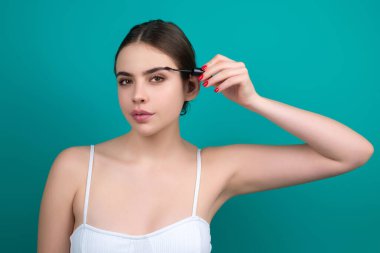 Mascara eyebrows. Natural beauty brows. Eyebrows coloring and lamination. Woman combing eyebrows. Makeup and cosmetology concept. Eyebrow shape modeling