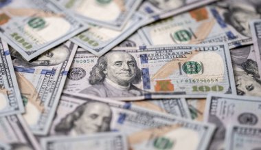 Money background with 100-dollar bills. Texture of US currency. 100 USD banknotes background. American hundred-dollar notes background. Pattern of US dollars for finance concept. USA many background