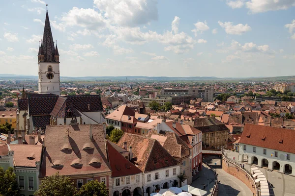 stock image Aerial drone view of the Historic Center of Sibiu, Romania. Lutheran Cathedral, old buildings, narrow streets and the main big city Square