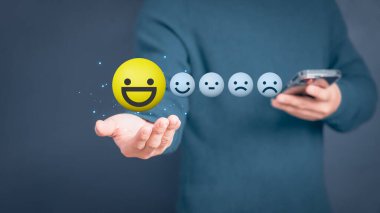 Man hand showing a happy smiley face icon. Testimonial of customer services best excellent business rating experience, satisfaction survey, positive review and feedback concept.