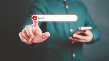 Information Search Technology SEO Search Engine Optimization. Search button on virtual screen pressed with finger for data and information. Using Search Console with your website. Web search concept.