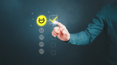 Man touching the virtual screen on the happy smiley face icon to give satisfaction in service. Rating very impressed. Assessment customer service, testimonial and satisfaction concept.