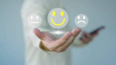 Man hand showing a happy smiley face icon. Testimonial of customer services best excellent business rating experience, satisfaction survey, positive review and feedback concept.