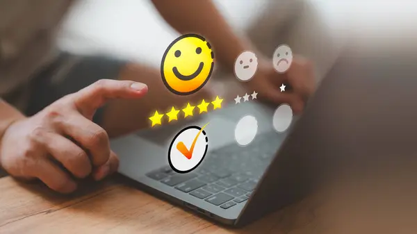 Customer service and satisfaction concept. Client choosing on the happy smile face icon to give satisfaction in service, rating very impressed. Testimonial review, good mood, feedback, best quality.