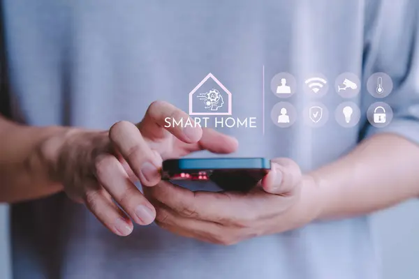 Adult man control technology AI smart home devices using a mobile phone with launched application. Internet of Things of smart home automation apps concept.