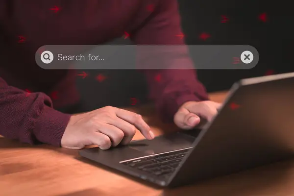 User using a laptop computer clicking internet search bar. SEO technology networking engine optimization internet with search bar. Searching browsing internet data information concept.